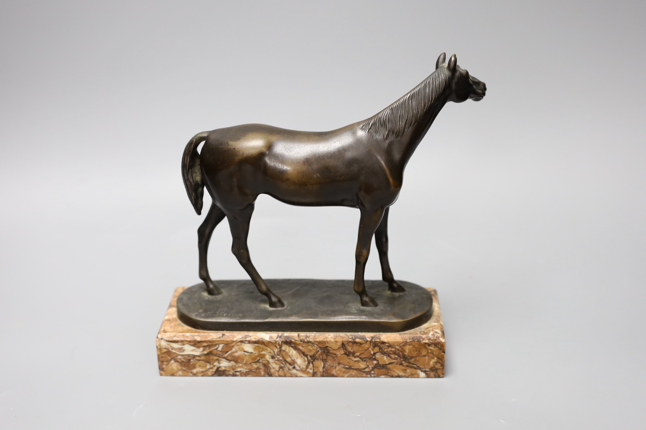 A 20th century bronze model of a horse, signed ‘K.Steiner’ the edge of the base incised ‘Ferd.Reiter Munchen’, on marble base, 22cm